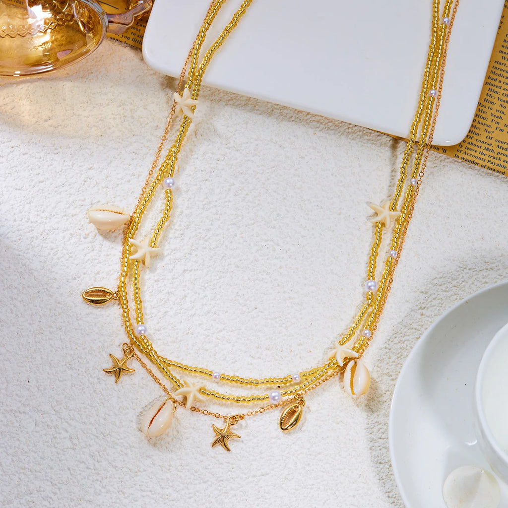 Chaîne de taille bohème tendance pour femme avec pendentifs étoile de mer, coquillage, tortue, papillon et perles de riz, bijou de corps pour fête de plage