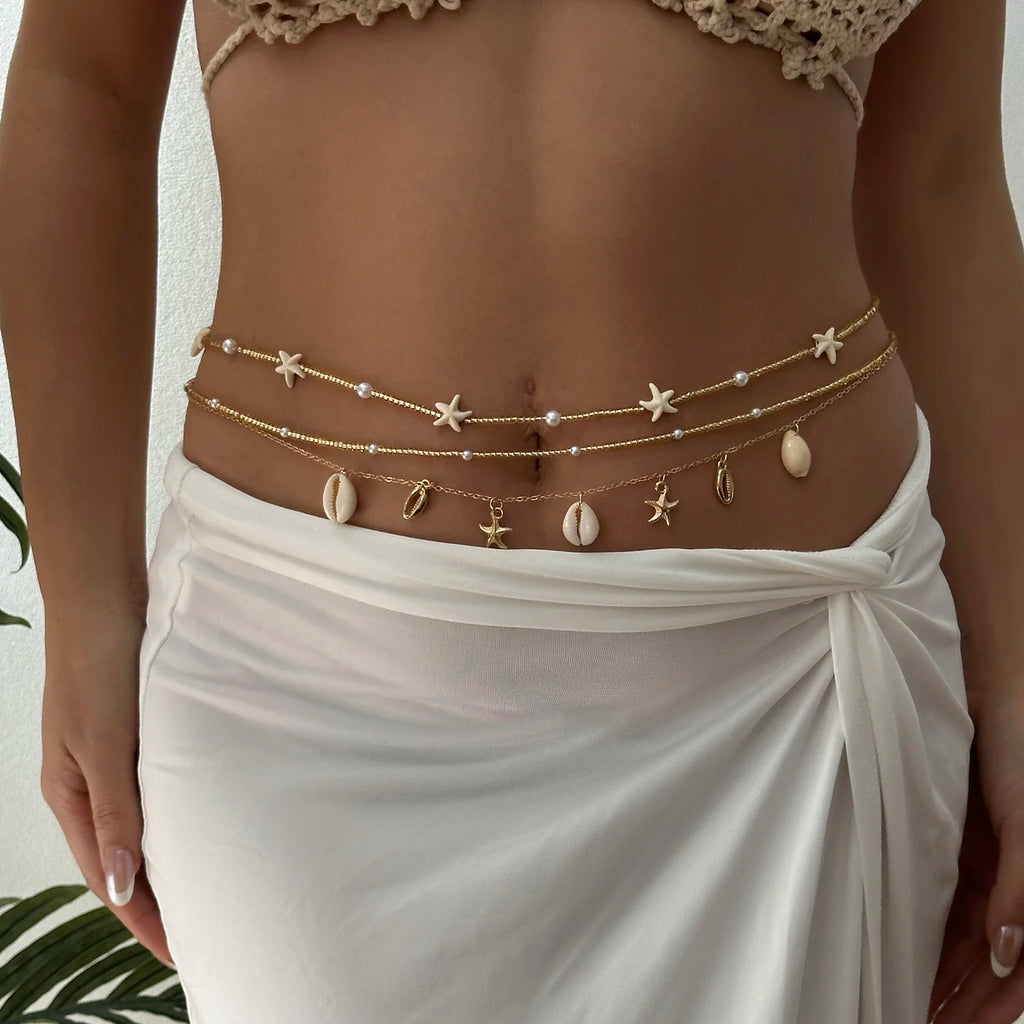 Chaîne de taille bohème tendance pour femme avec pendentifs étoile de mer, coquillage, tortue, papillon et perles de riz, bijou de corps pour fête de plage
