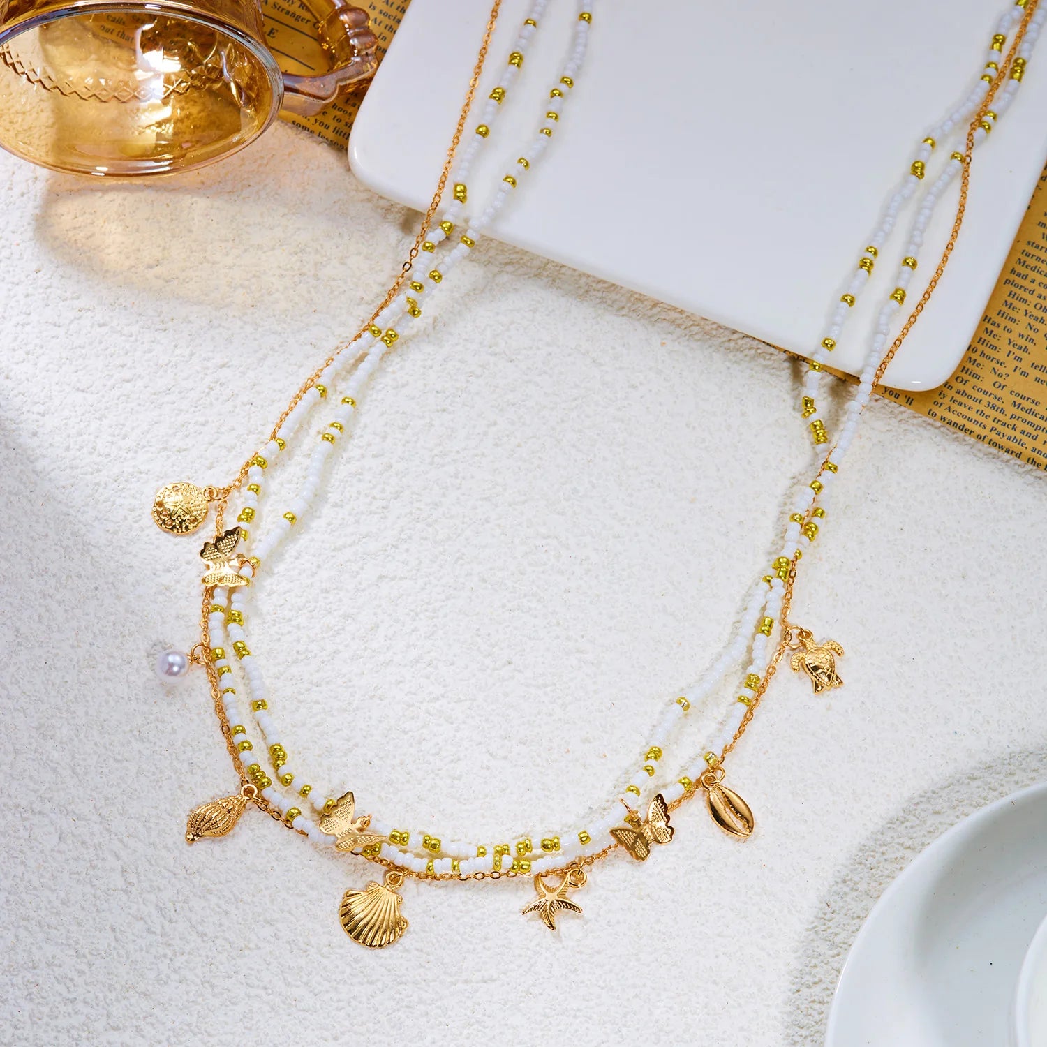 Chaîne de taille bohème tendance pour femme avec pendentifs étoile de mer, coquillage, tortue, papillon et perles de riz, bijou de corps pour fête de plage